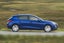 SEAT Leon Review 2023: exterior side photo of the SEAT Leon on the road