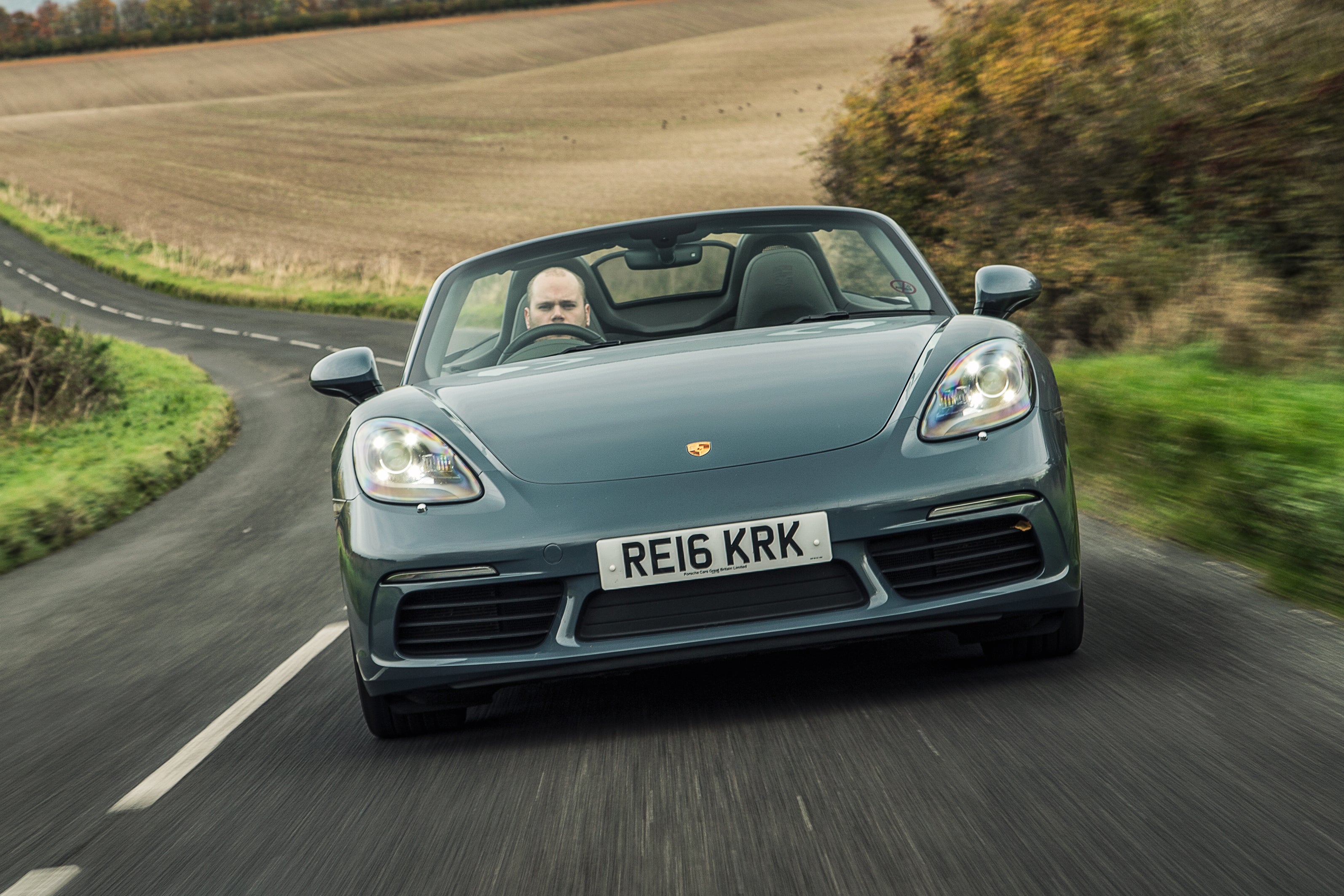 Porsche 718 Boxster Review 2023: exterior front photo of the Porsche Boxster 718 on the road
