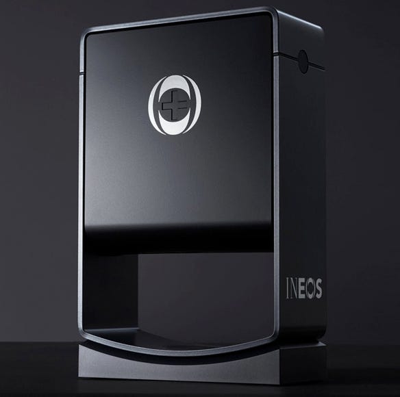 a photo of a black ineos hygienics hand sanitiser dispenser