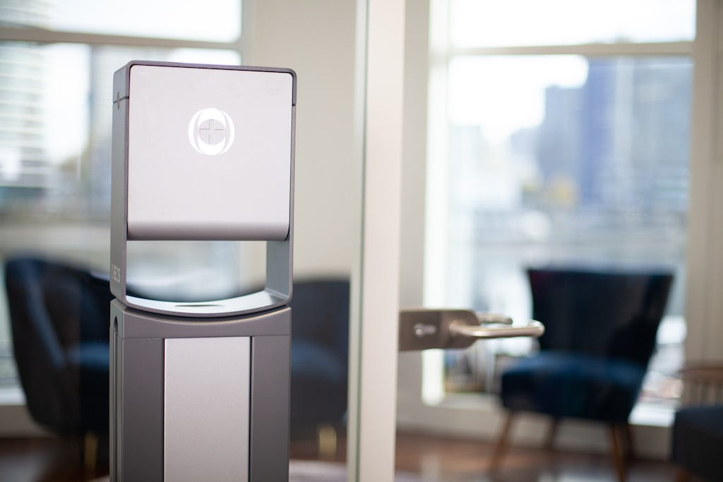 a photo of an ineos hygienics hand sanitiser dispenser in an office