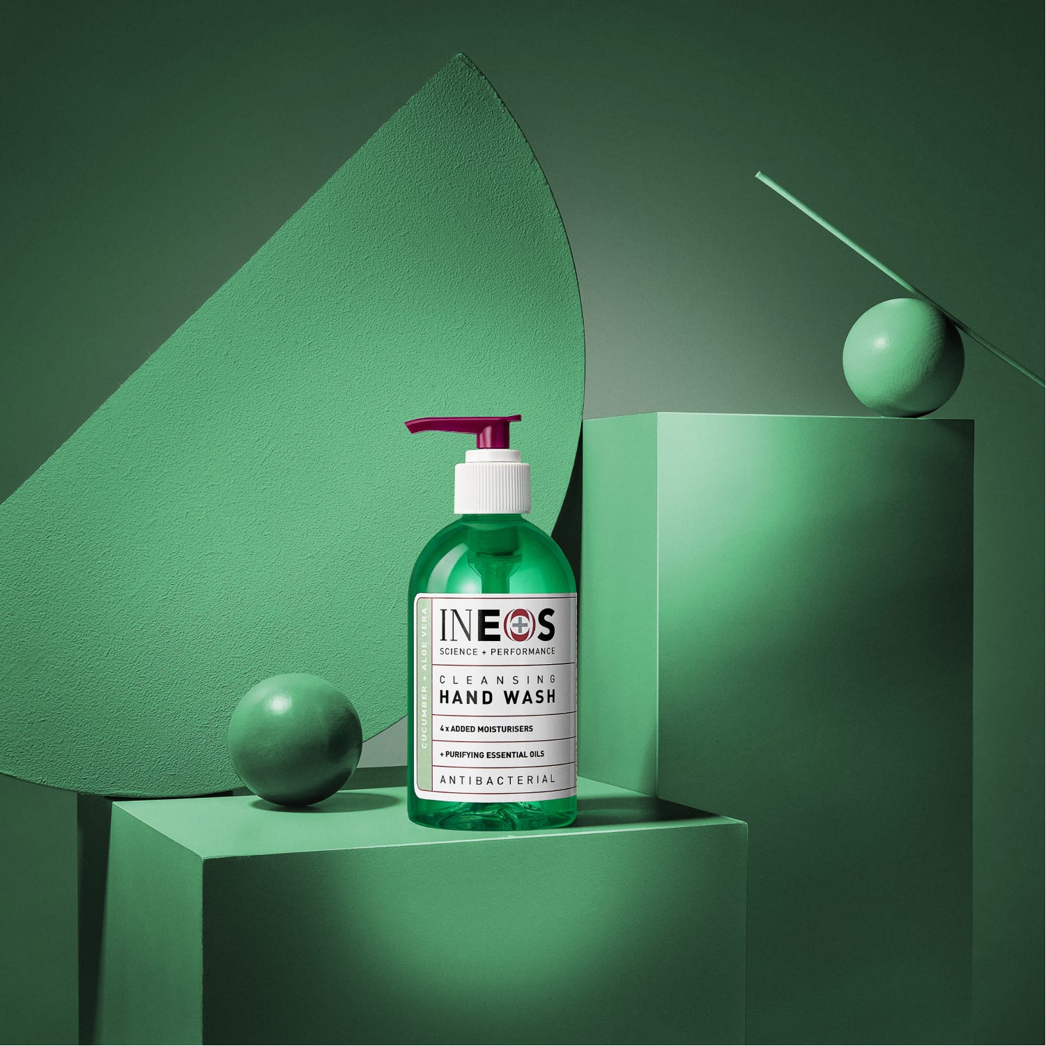 a photo of ineos hygienics cleansing aloe vera and cucumber hand wash on a green abstract background