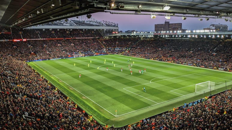 a wide shot of a packed football stadium