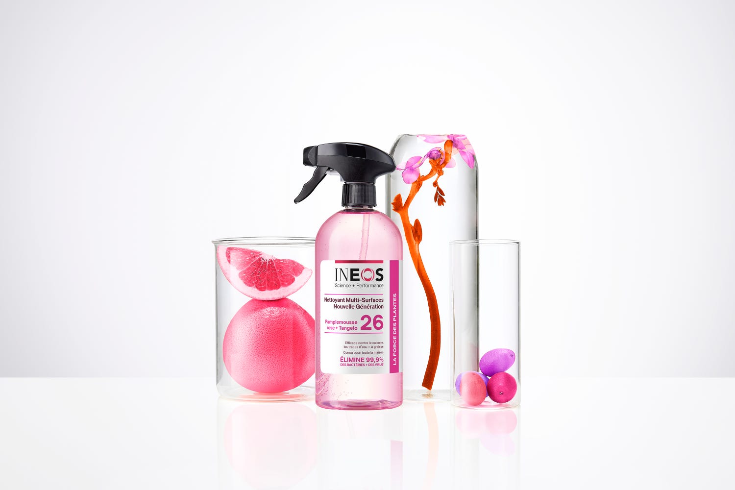 a photo of the french version of the pink grapefruit and tangelo multi room cleaner in a white studio