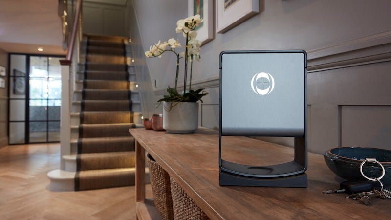 a photo of an ineos hygienics hand sanitiser dispenser in a hallway