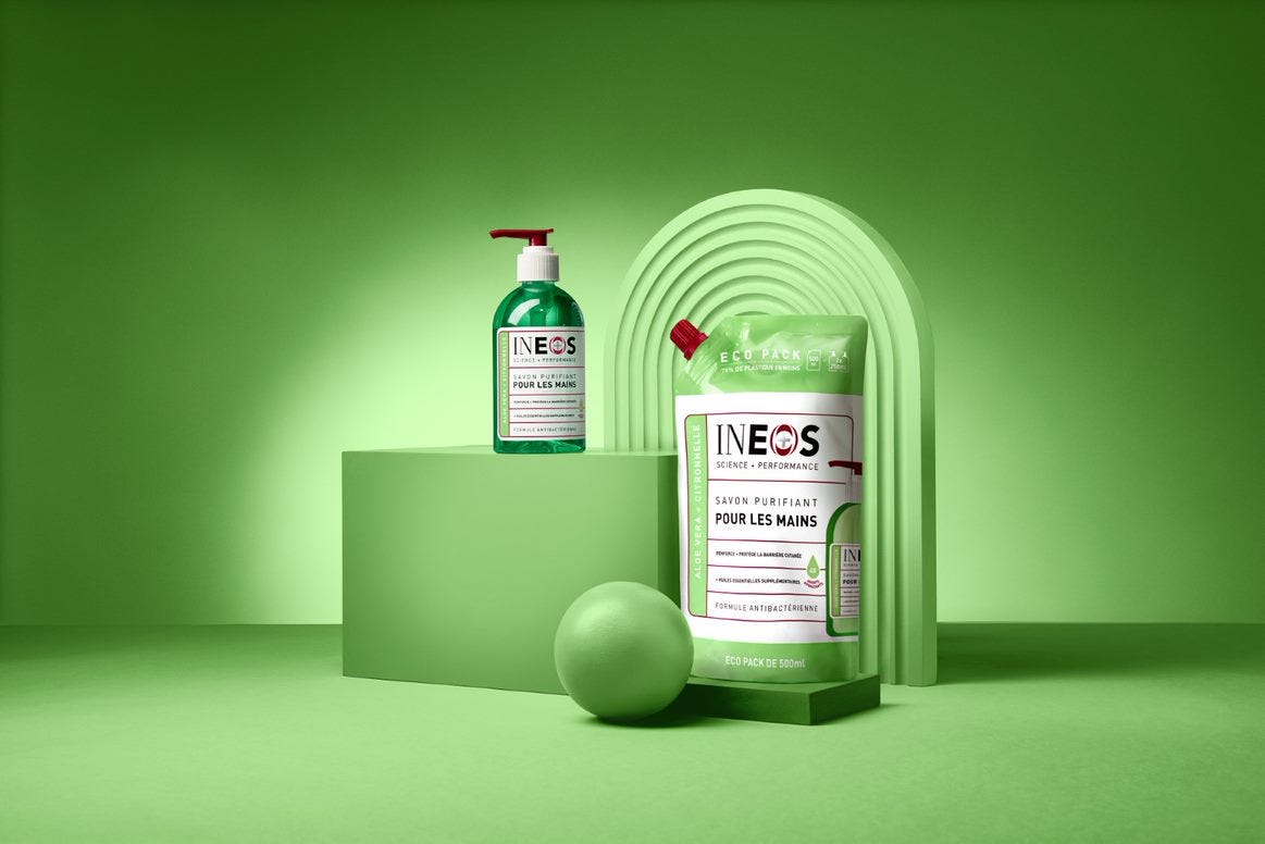 a photo of the french ineos hand wash and refill pack on a green background