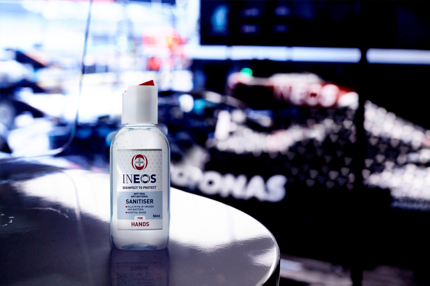 a photo of a travel sized bottle of ineos hygienics hand sanitiser