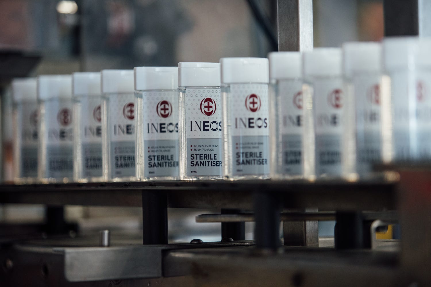 a photo of a conveyor belt of ineos hygienics hand sanitiser