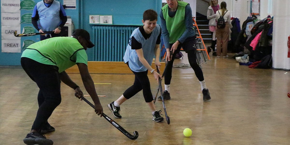 Team Up coaching session in a primary school in London. Teachers Playing Hockey 