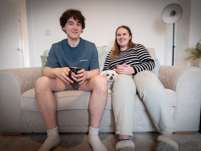 Couple sat on sofa