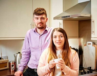 Jasmine and James in the kitchen of their shared ownership home