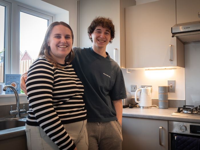 Couple stood in kitchen