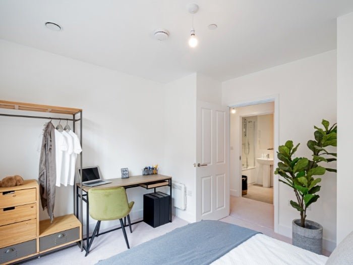 Interior photo of a furnished bedroom in a type 6 apartment at Knights Quarter