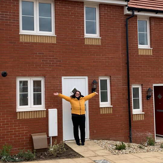 Photo of Meg outside her new shared ownership home
