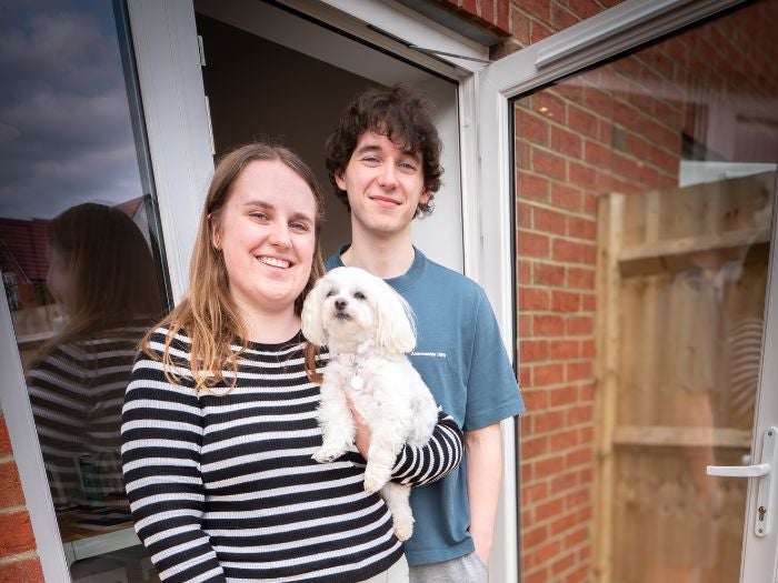 Couple stood by their back door