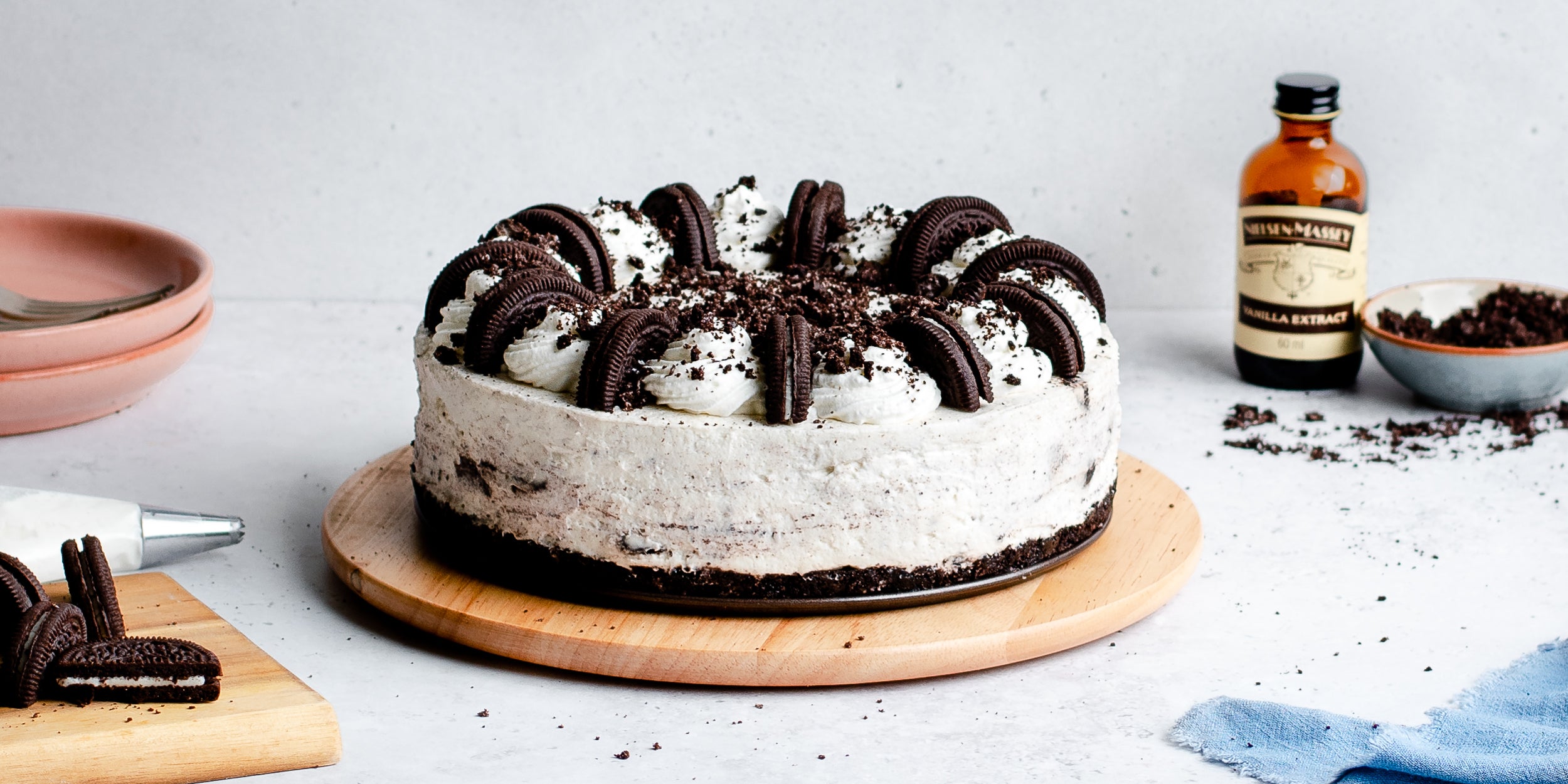 No-bake Oreo cheesecake with bottle of vanilla extract in background