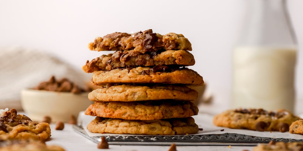 Stack of homemade Millie’s cookies on a baking tray