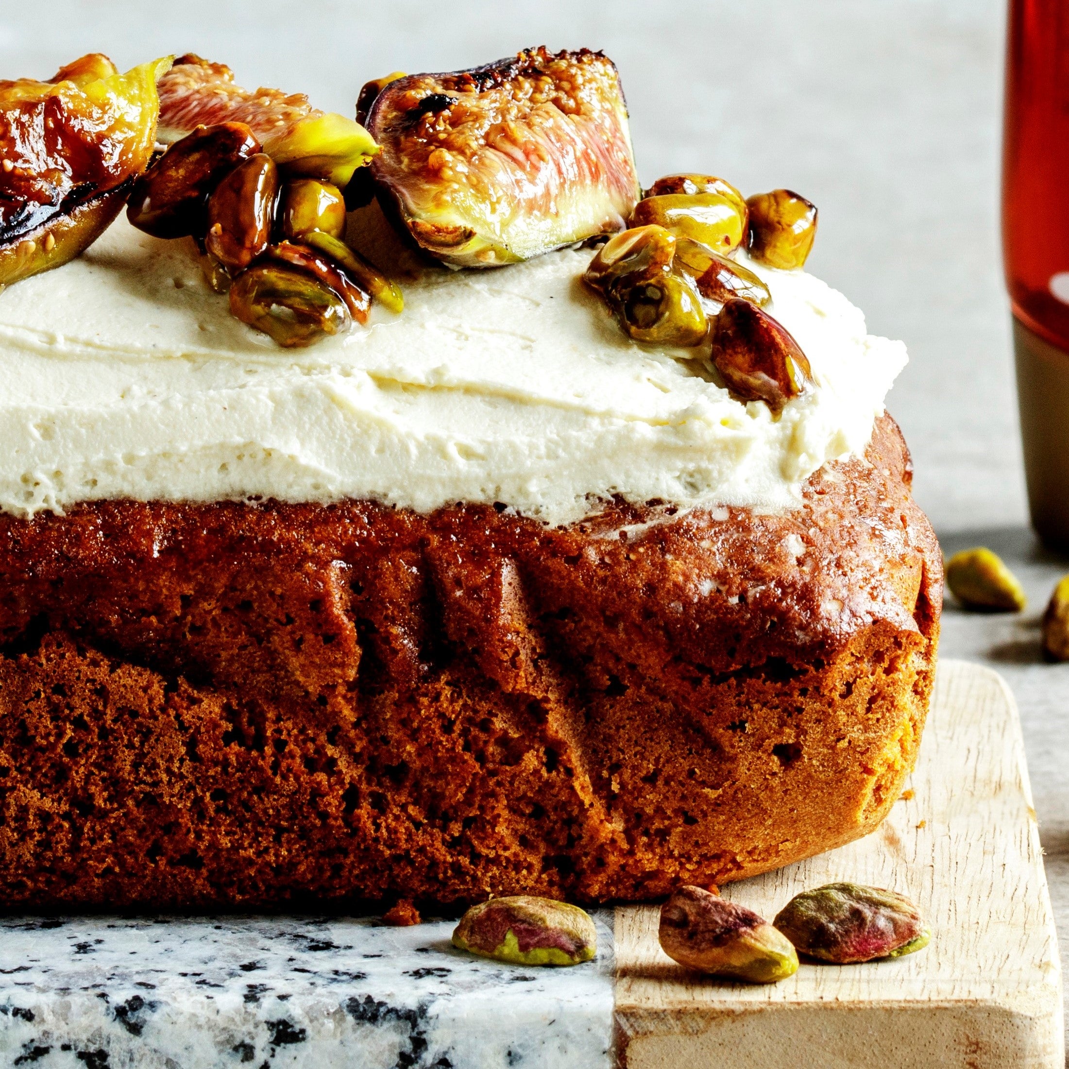 Close up of loaf cake with mascarpone topping and figs
