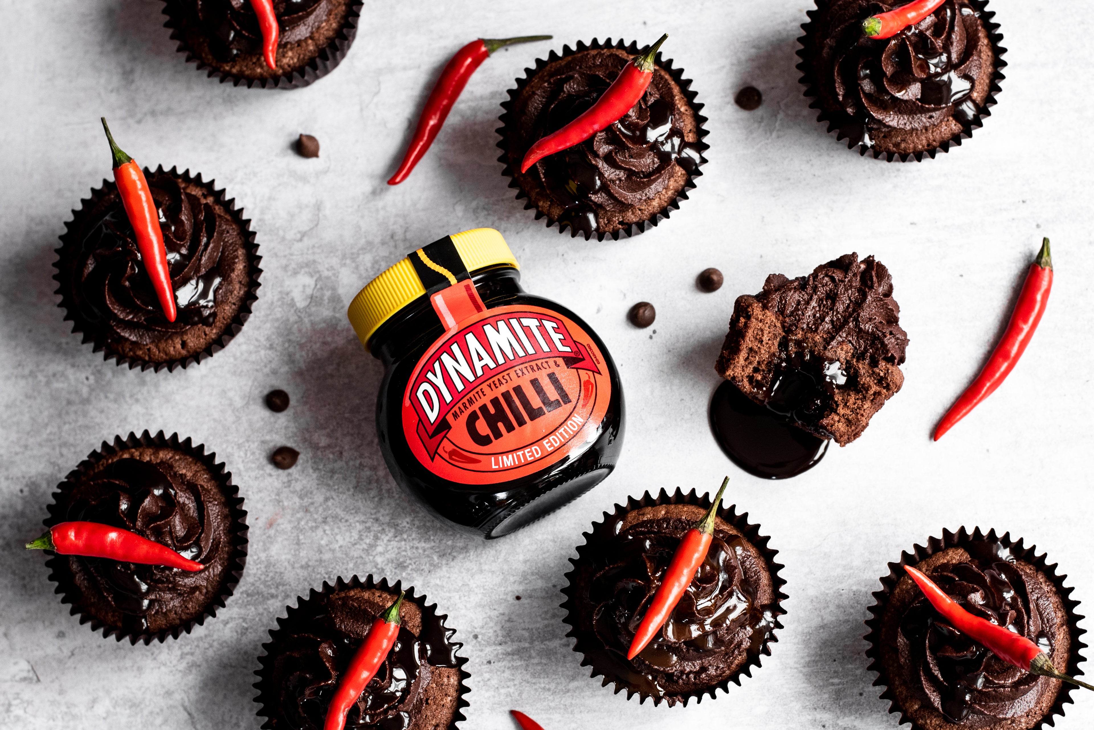 birds-eye view of chocolate cupcakes next to dynamite chilli jar