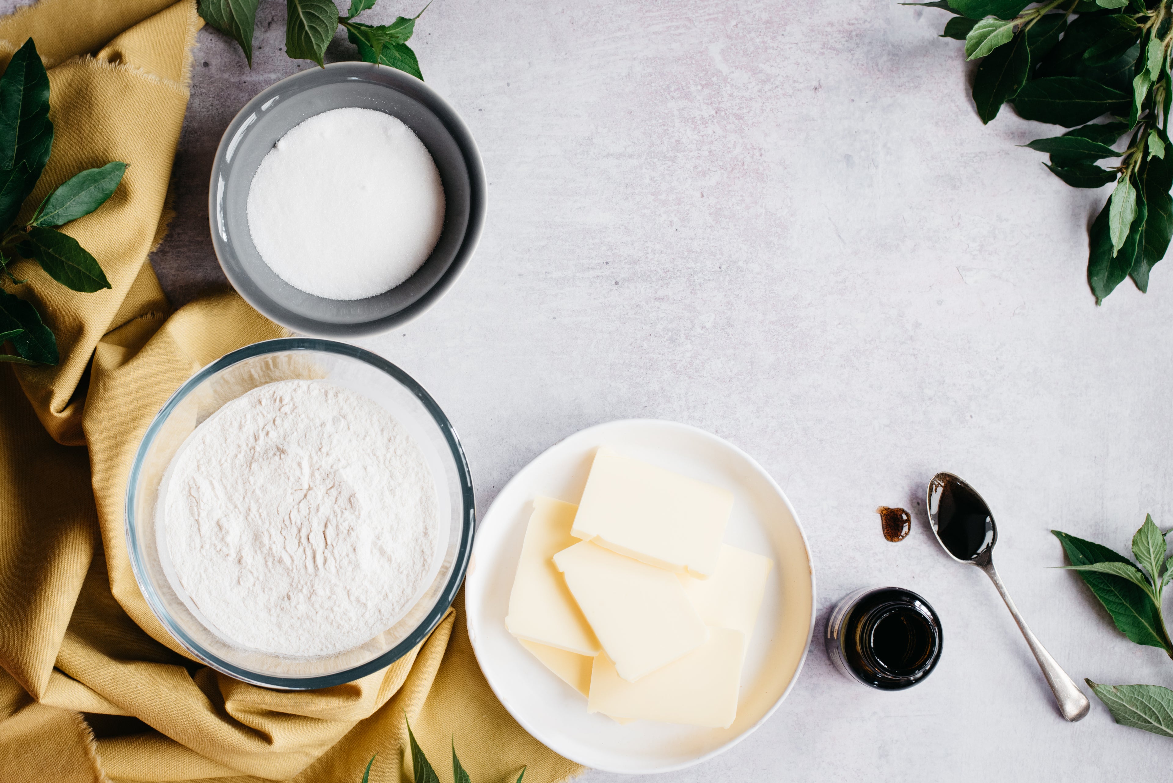 Top down view of ingredients to make healthy shortbread including butte and truvia for baking