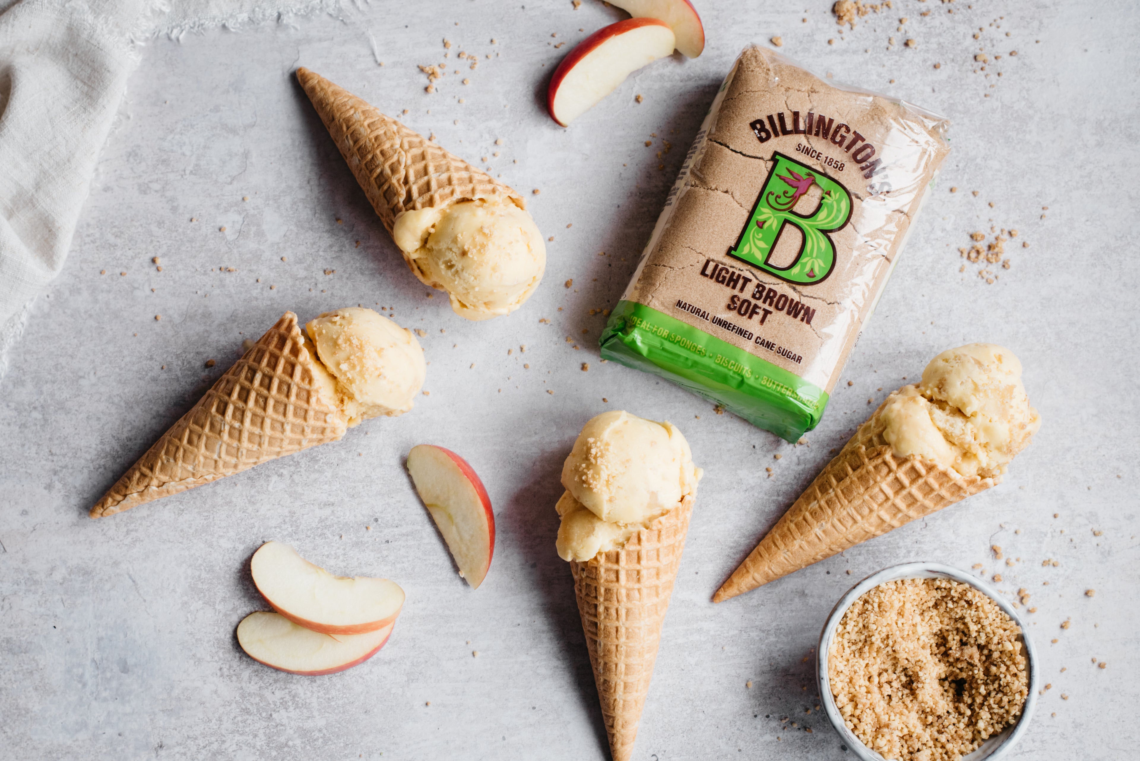 4 ice cream in cones with apple slices and brown sugar pack