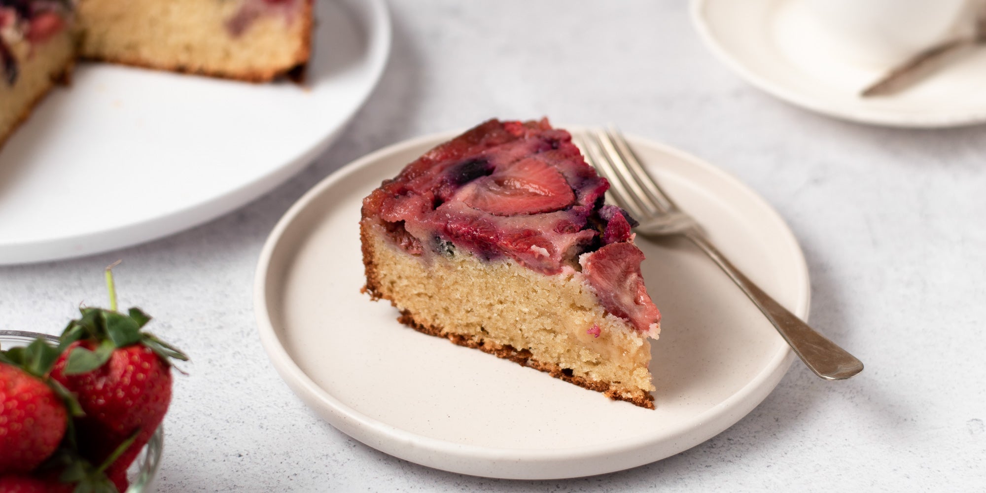 slice of upside down berry pudding on a plate