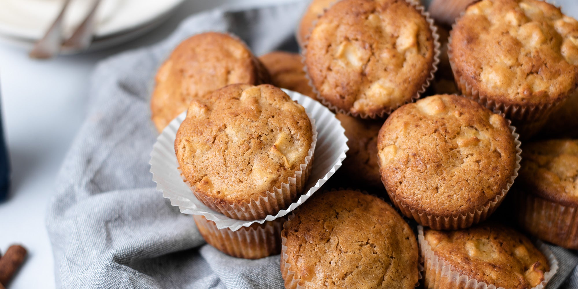 Close up of Calorie Conscious Apple & Cinnamon Muffins on a grey cloth