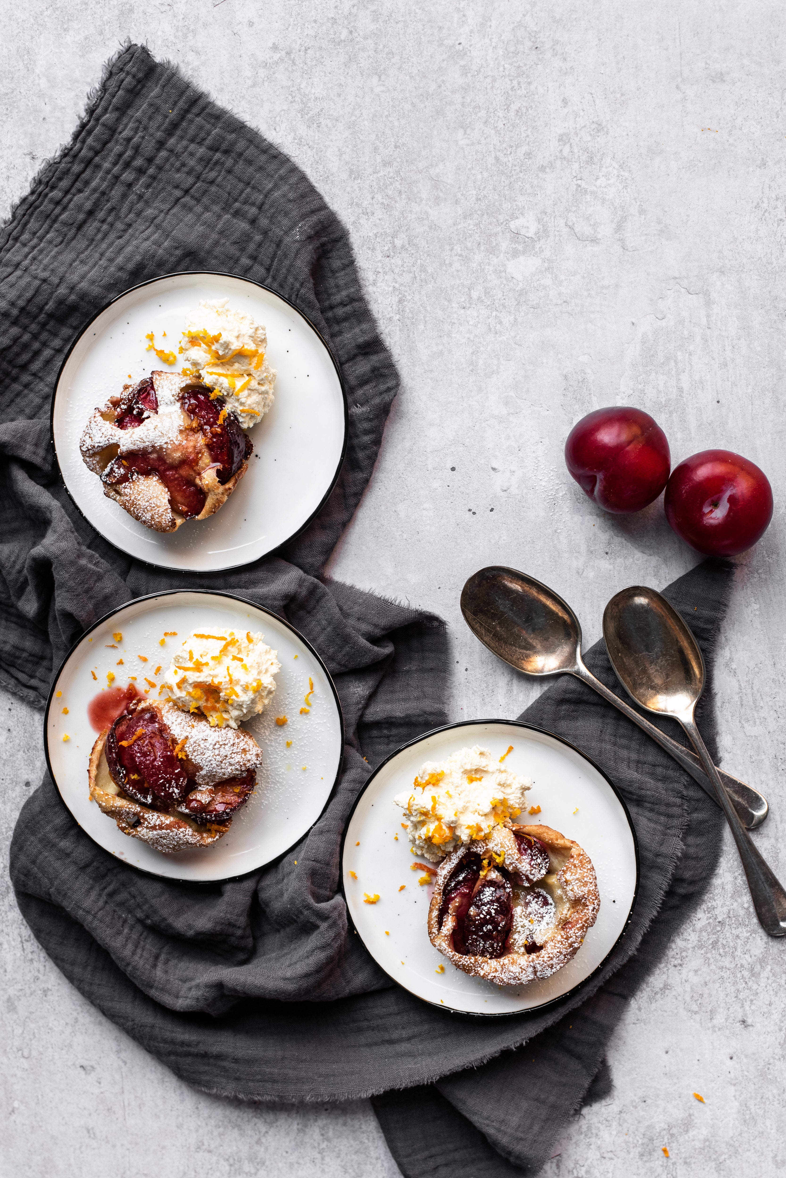 caramelised plum Yorkshire puddings on plates
