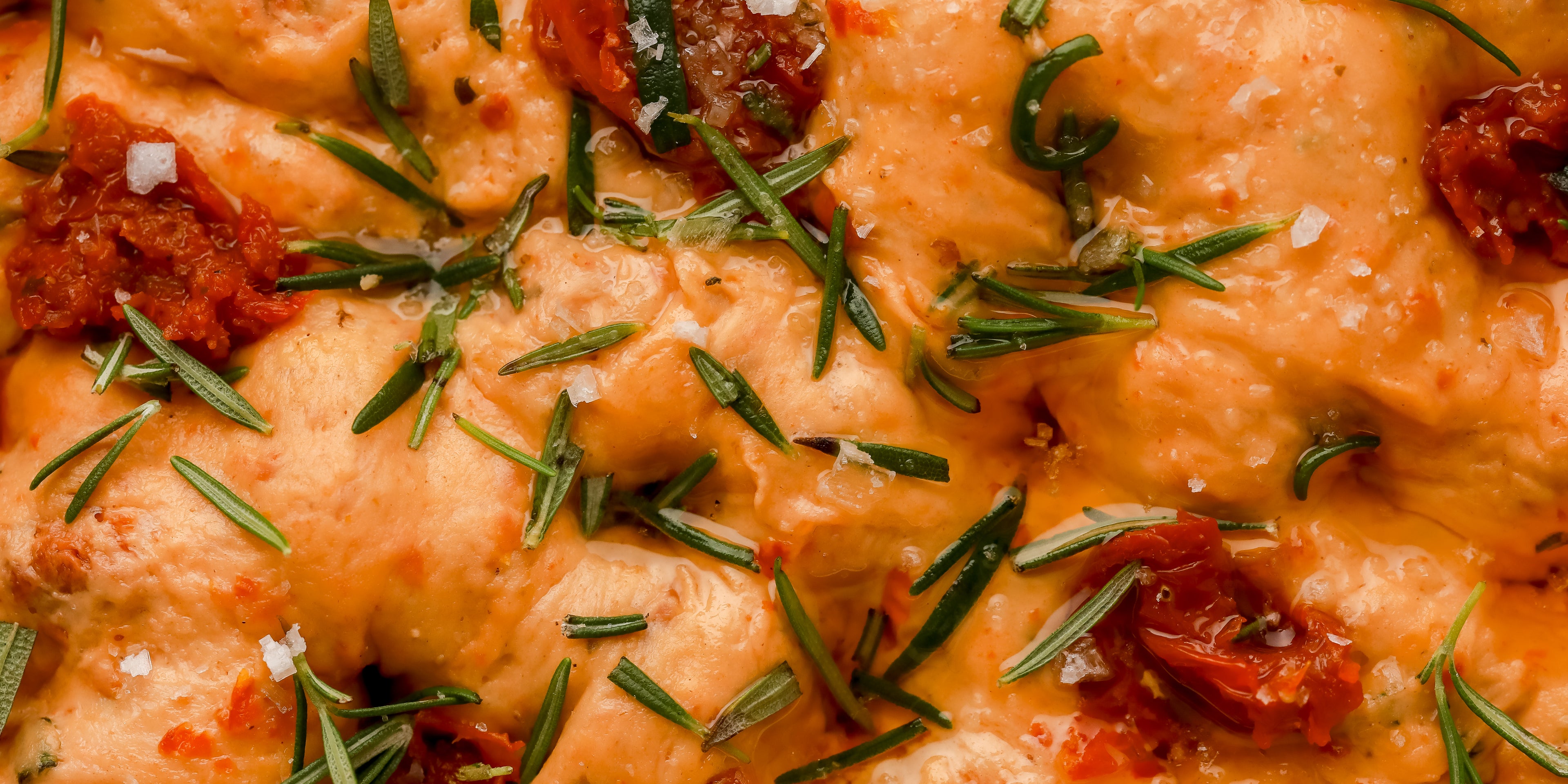 Close up of sundried tomato bread with herbs on top