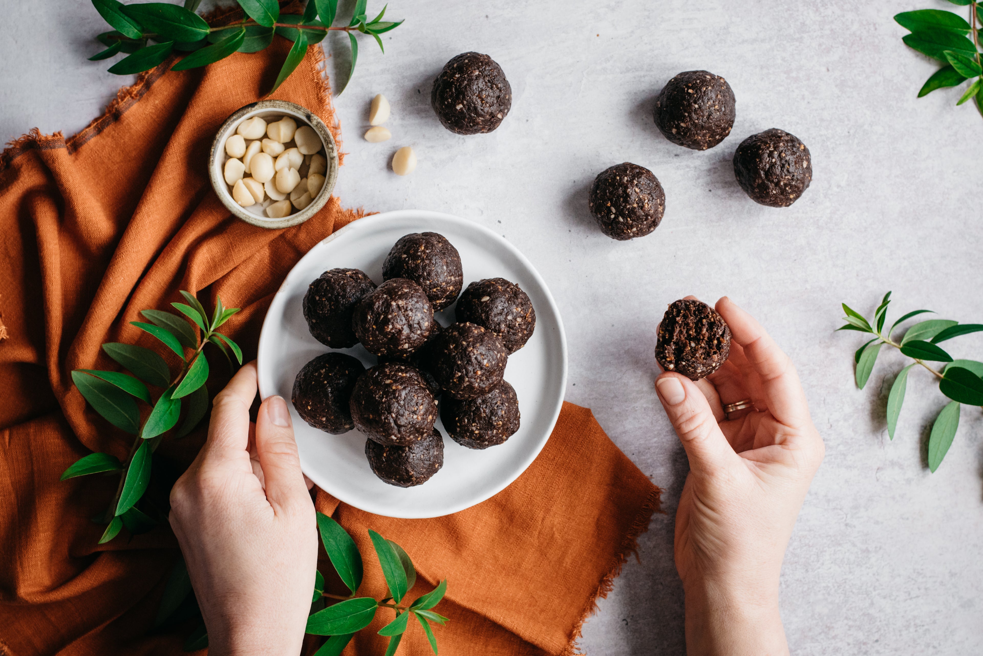 Top down view of a plate of raw vegan energy balls