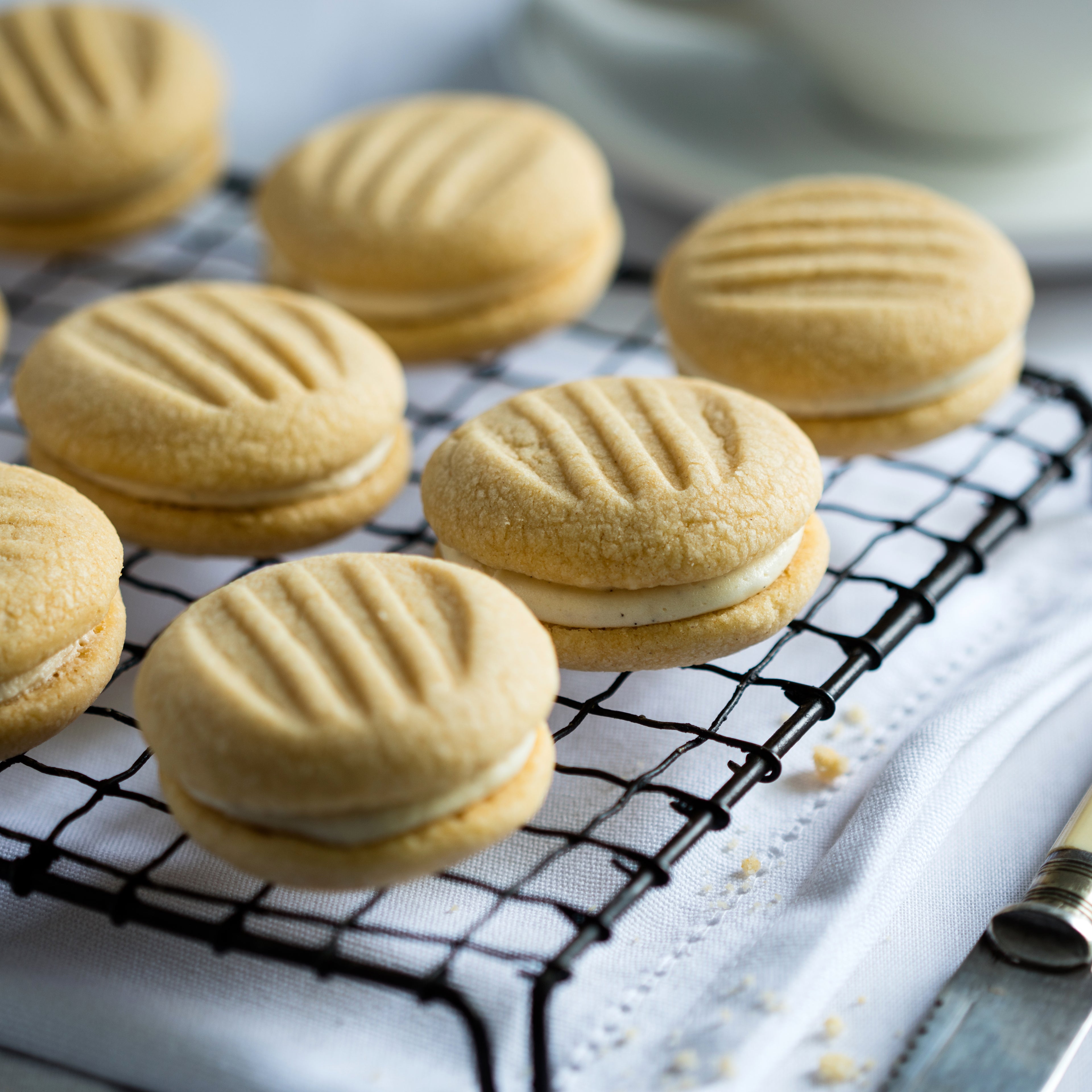 Close up on biscuits lined up on cooling rack