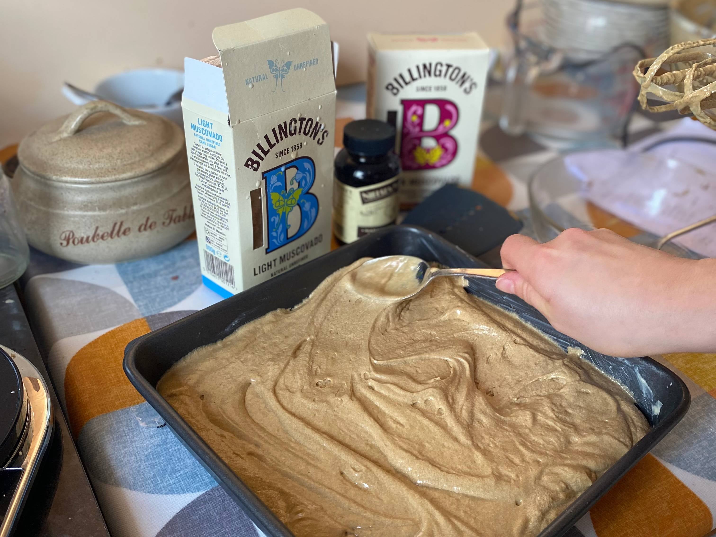 Smoothing out the cake mixture for Mary Berry and Nigella's sticky toffee pudding with Billington's Muscovado Sugar
