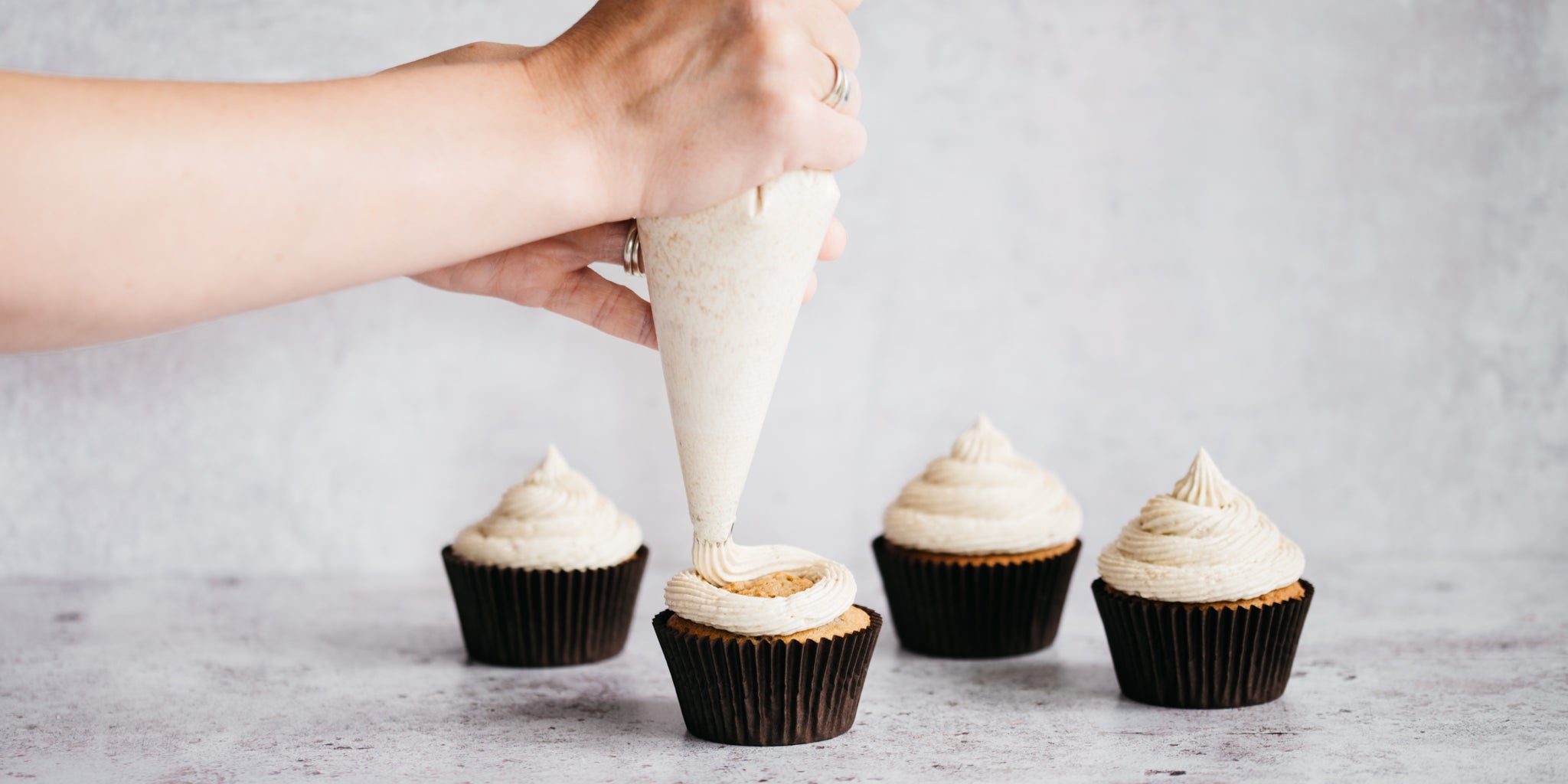 Coffee Cupcakes being whirled with a coffee buttercream