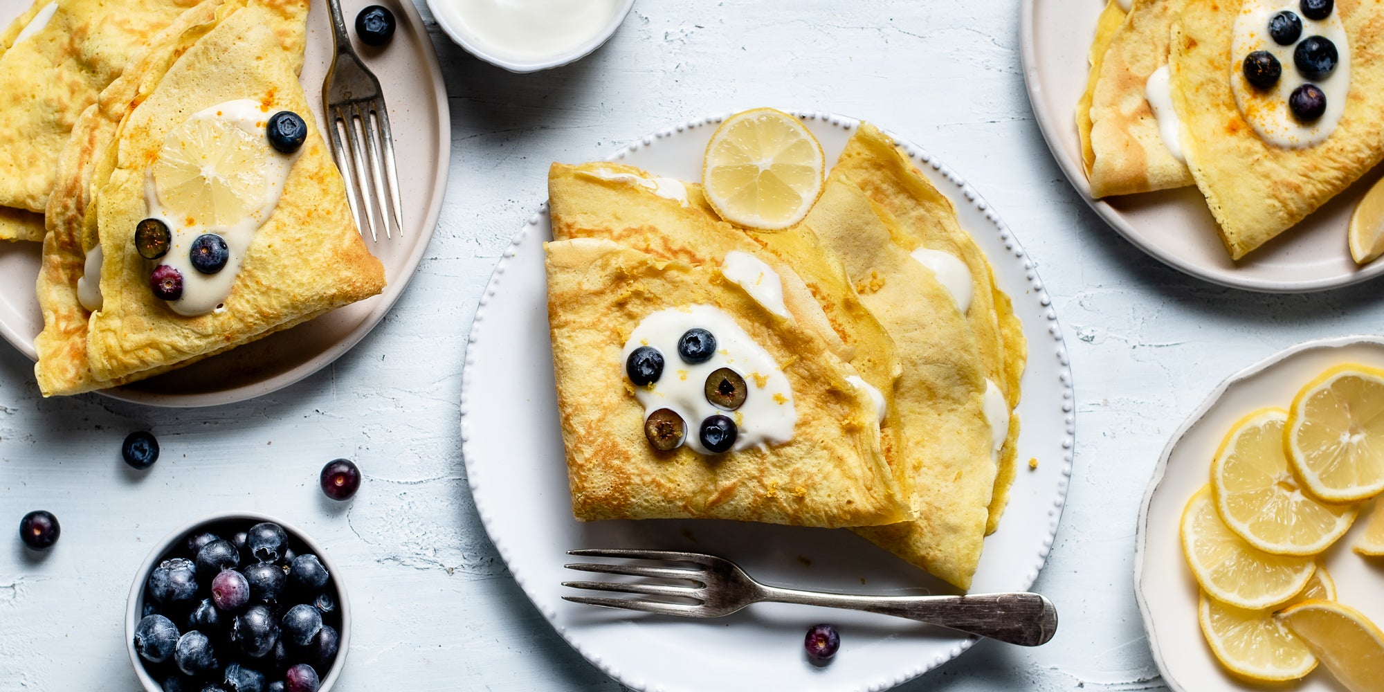 Top down view of a plate of turmeric and lemon pancakes