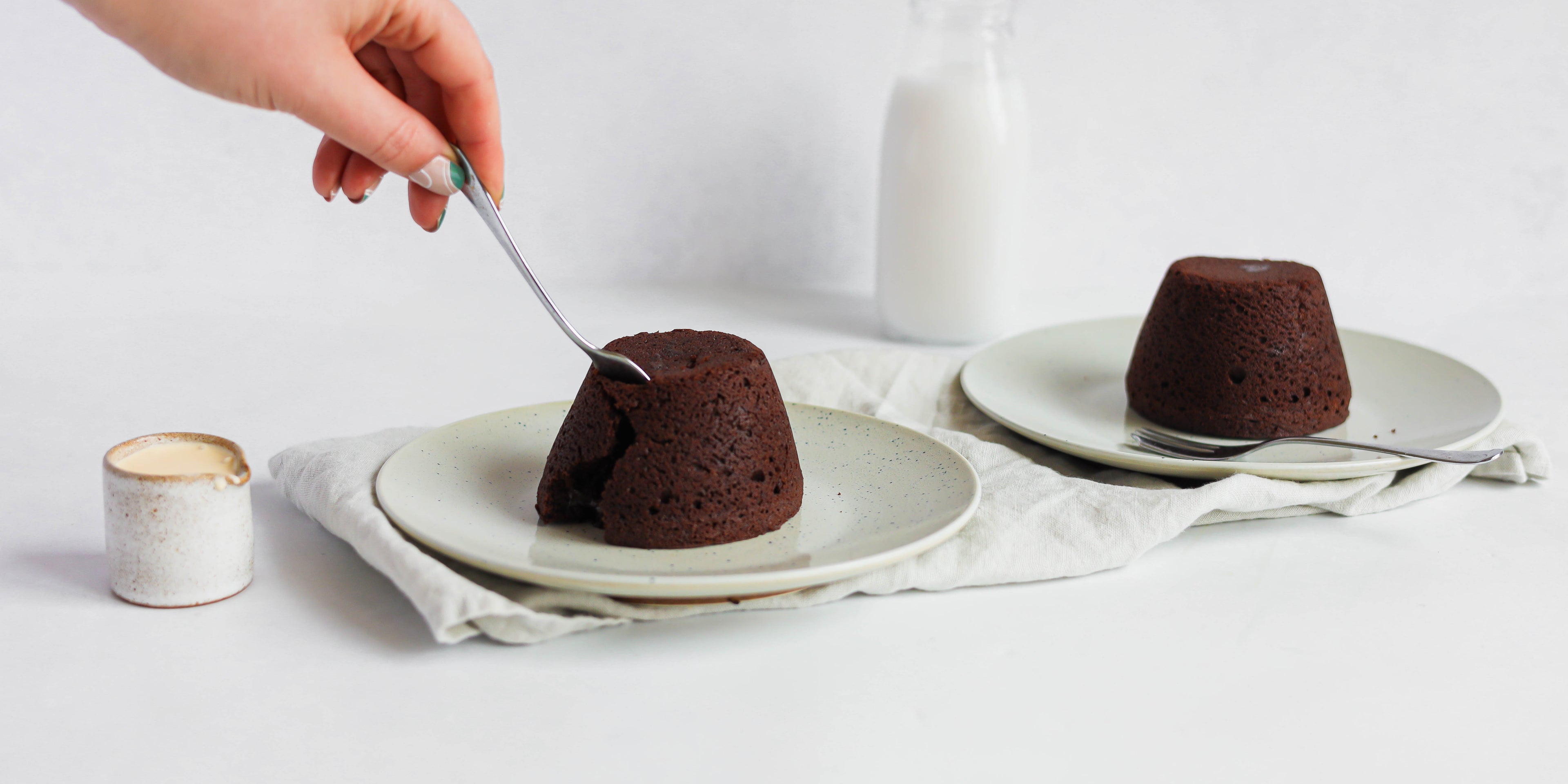 A spoon slicing into a terrys chocolate orange mini chocolate pudding