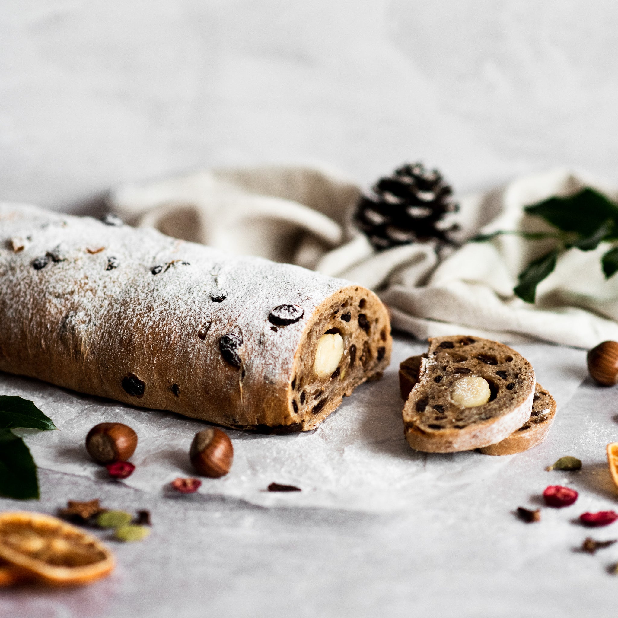Vegan stollen with a slice removed showing marzipan in the middle