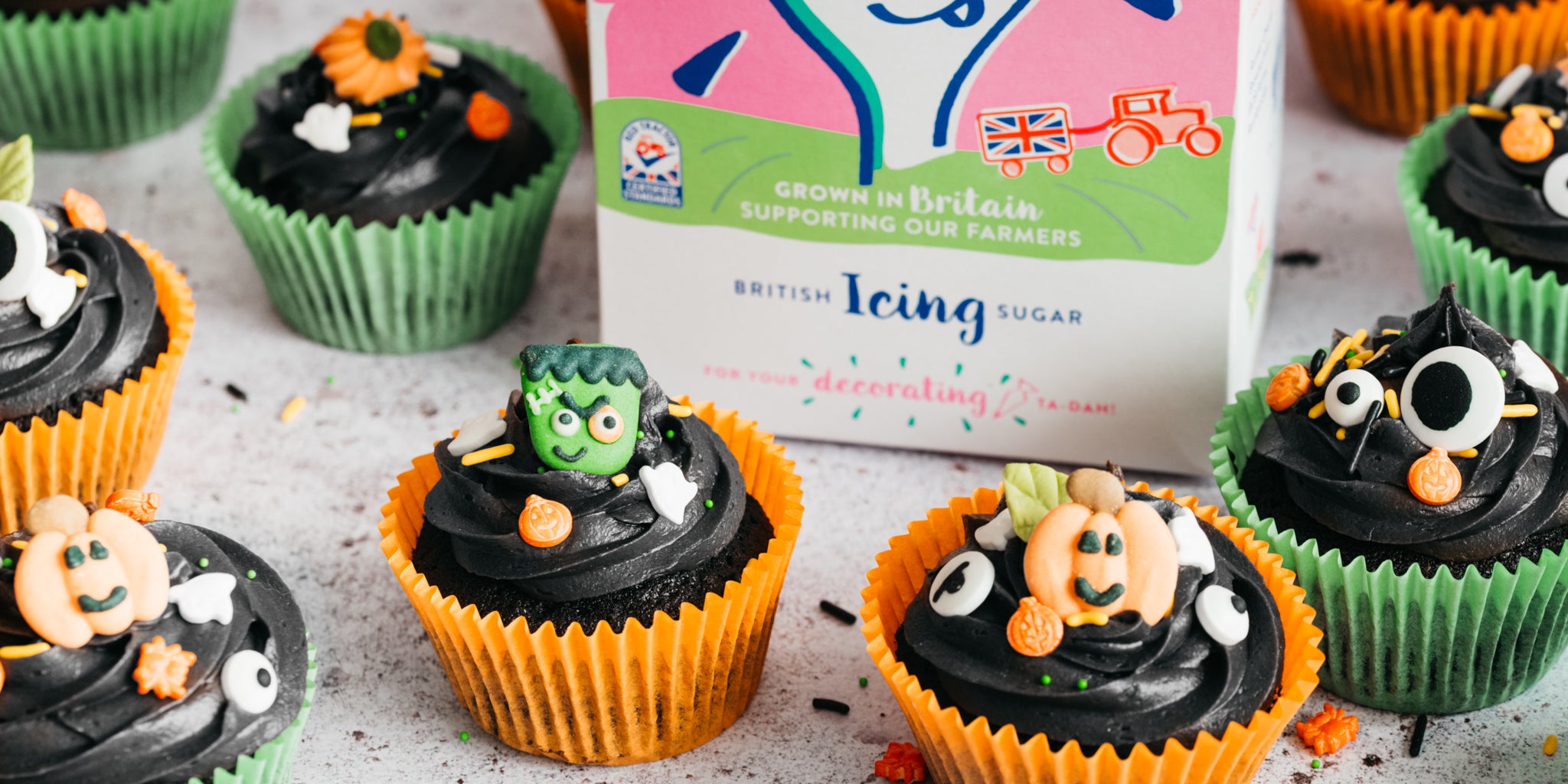Black halloween cupcakes with icing sugar pack