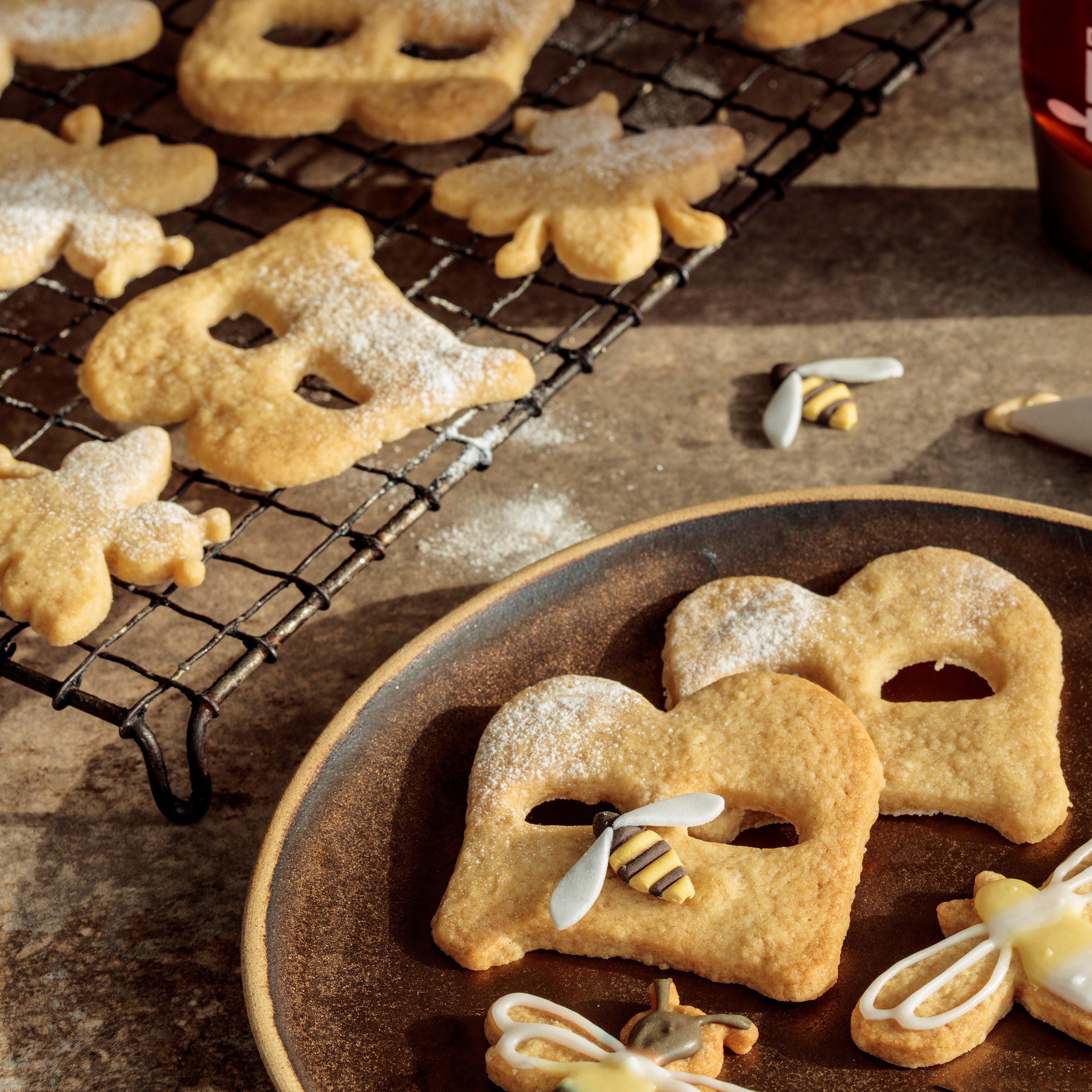 Biscuits in shape of letter B and bumble bees