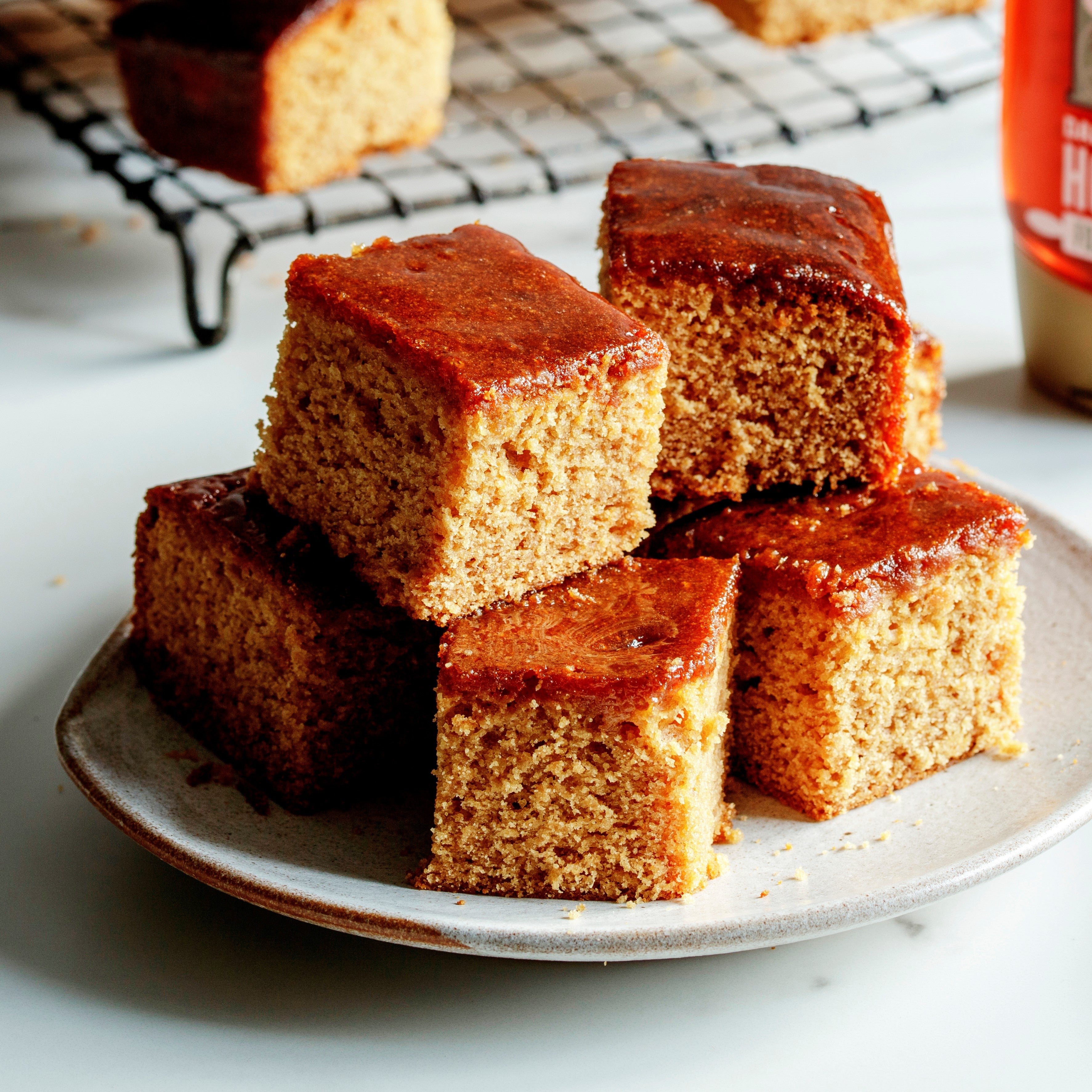 Squares of cake stacked on a plate