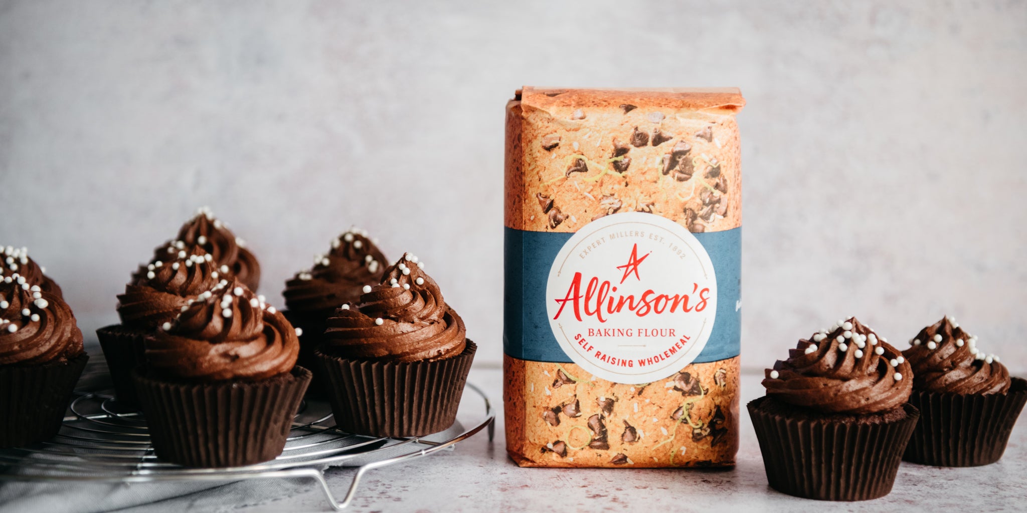 Wholemeal Chocolate Cupcakes next to a bag of Allinson's Wholemeal Self Raising flour