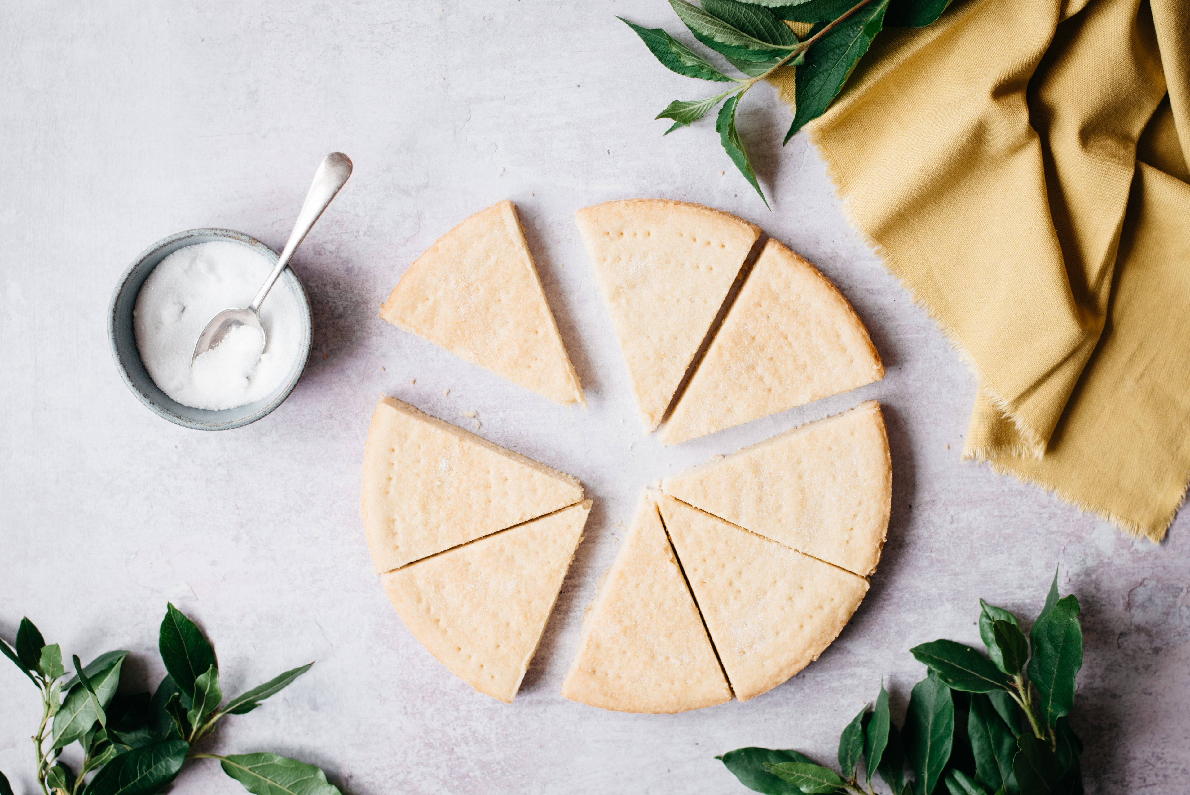 Top down view of a knife slicing through some healthy shortbread