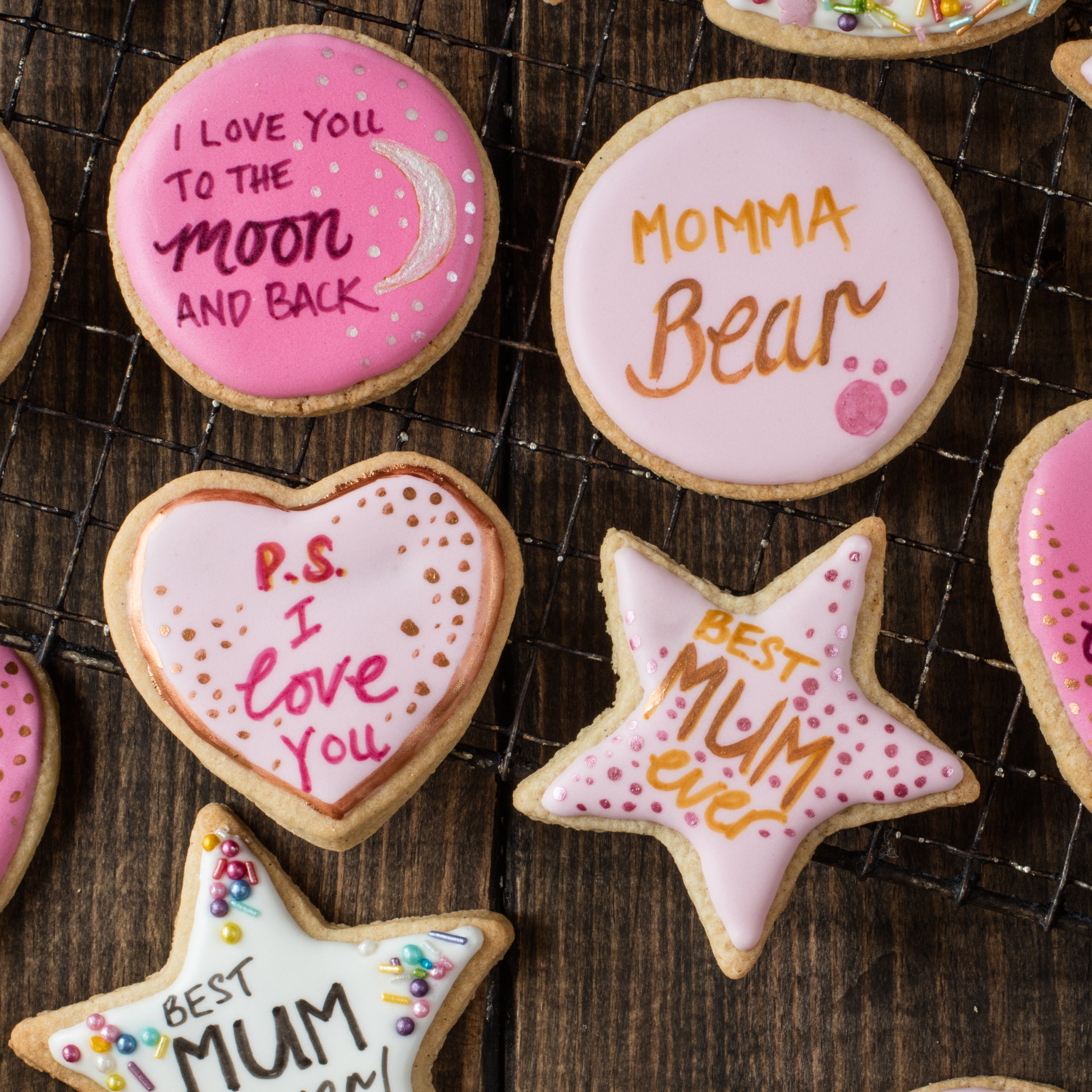 Close up of mothers day iced cookies with motivational writing on it