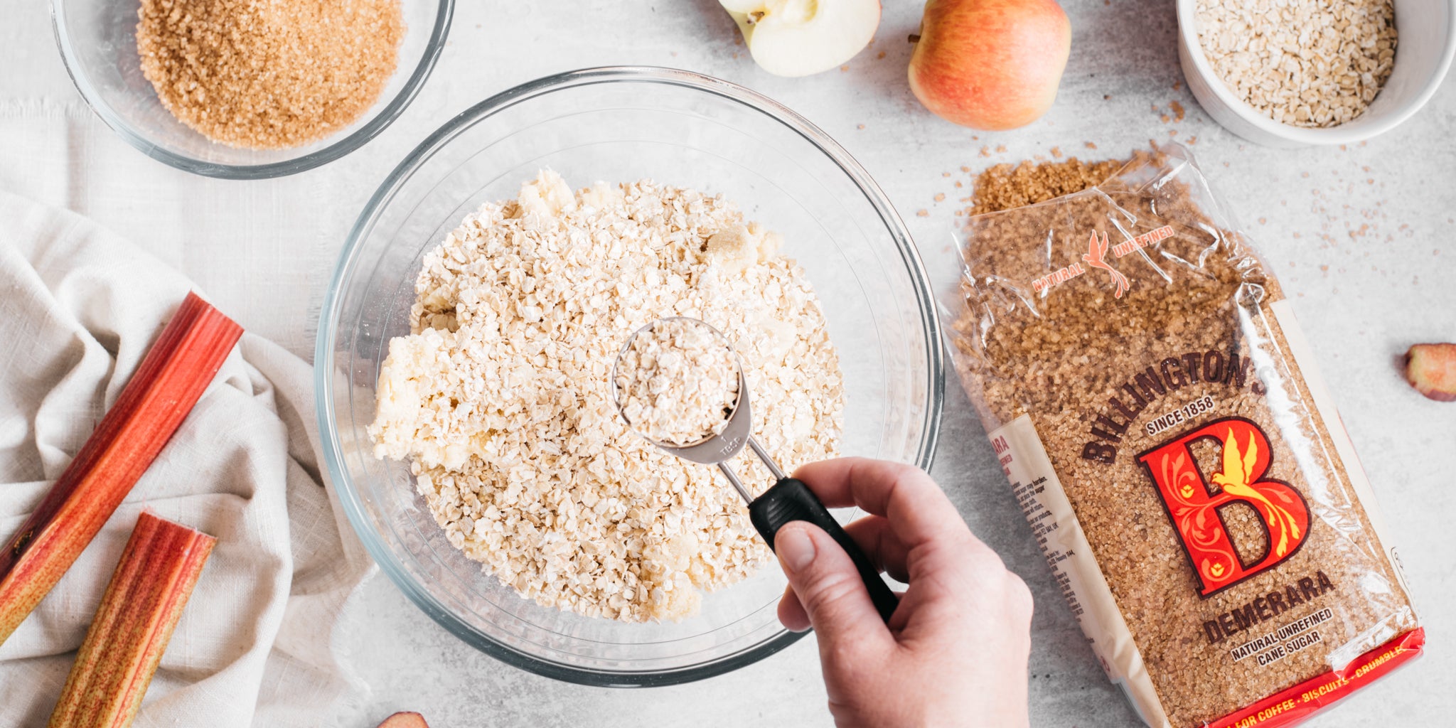 Spoonful of flour being added to a bowl