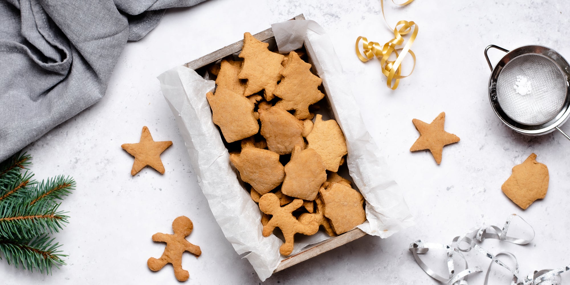 Top down view of vegan gingerbread men and stars in a box