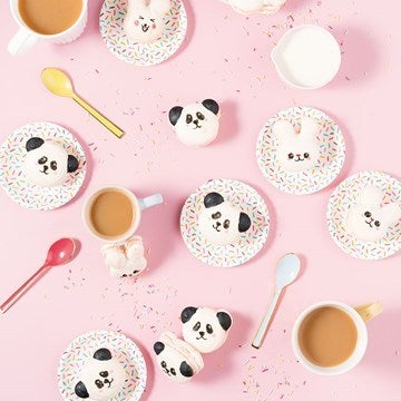 Kawaii panda head cookies on plates