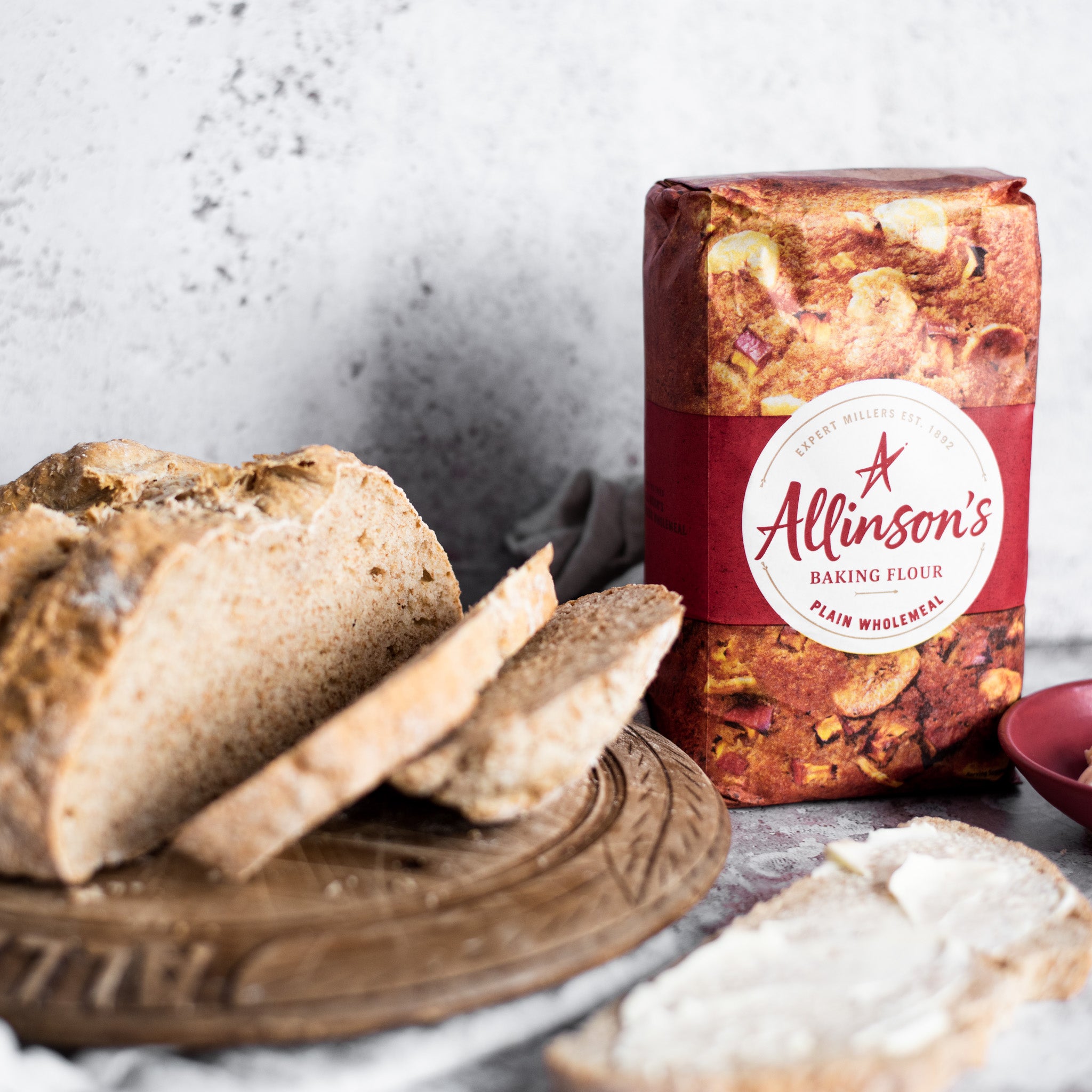 Slices of soda bread next to a bag of Allinson's Baking Flour