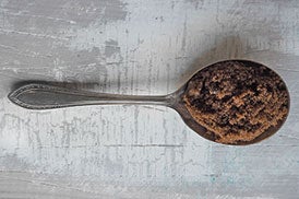 dark muscovado sugar on a spoon