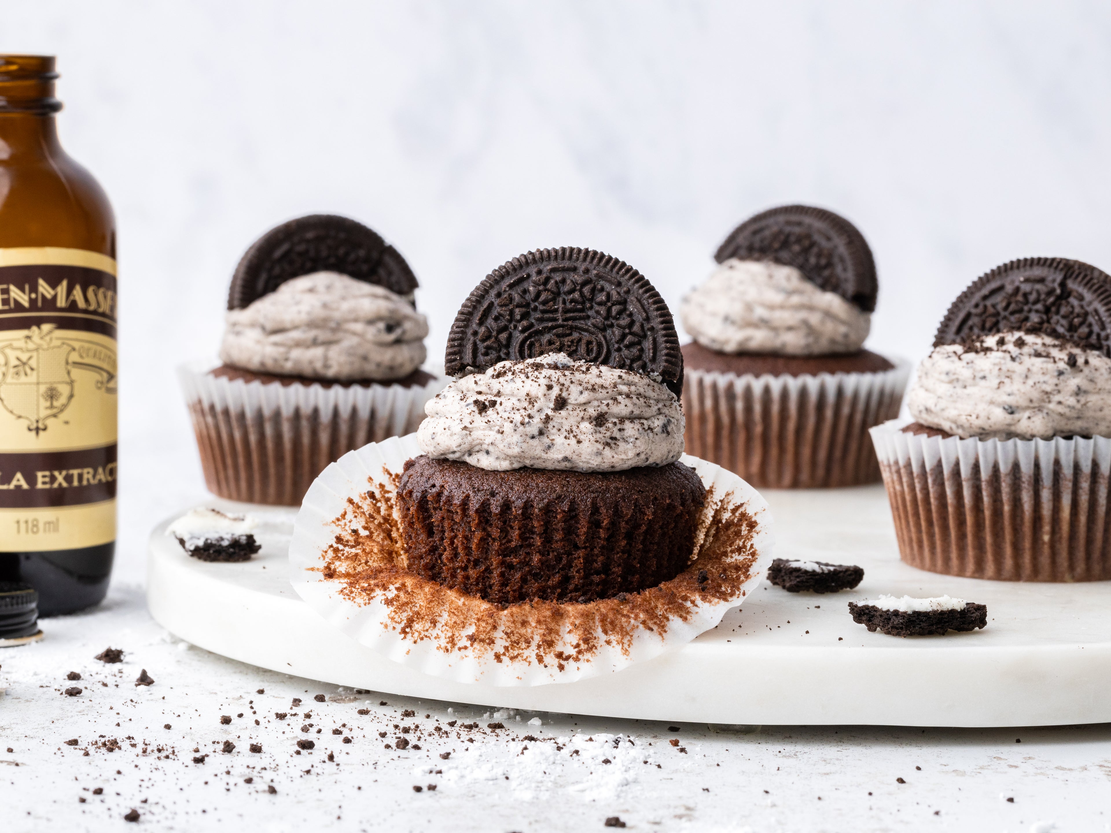 4 oreo cupcakes with wrapper peeled back
