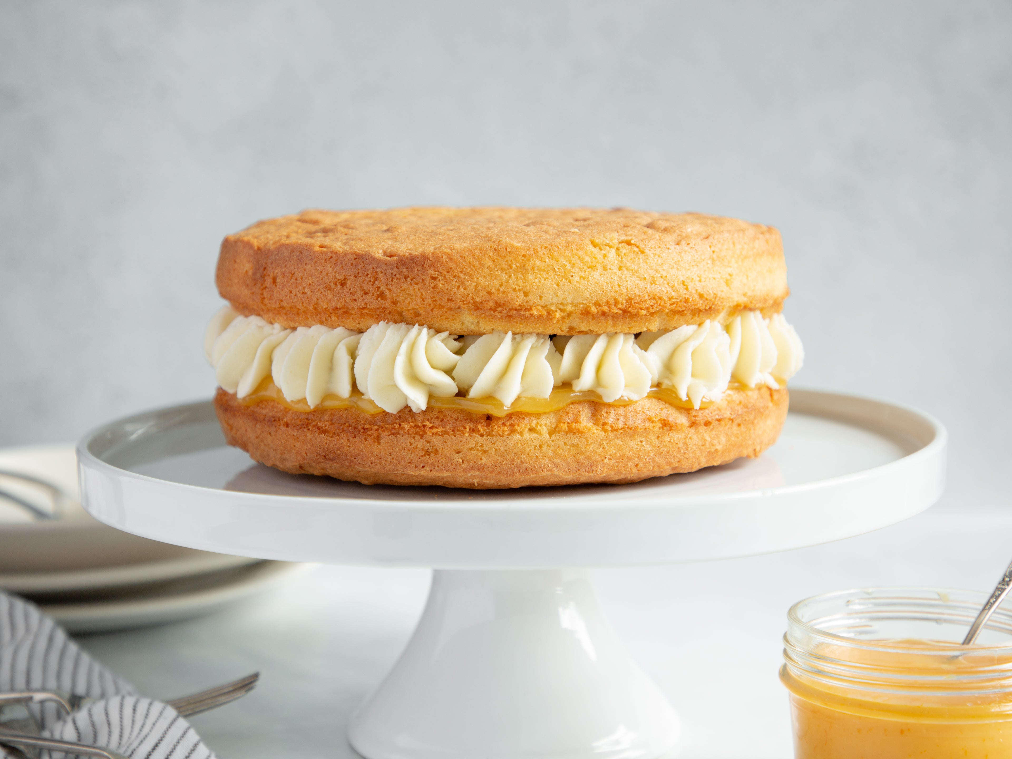 Lemon cake filled with lemon curd and buttercream swirls