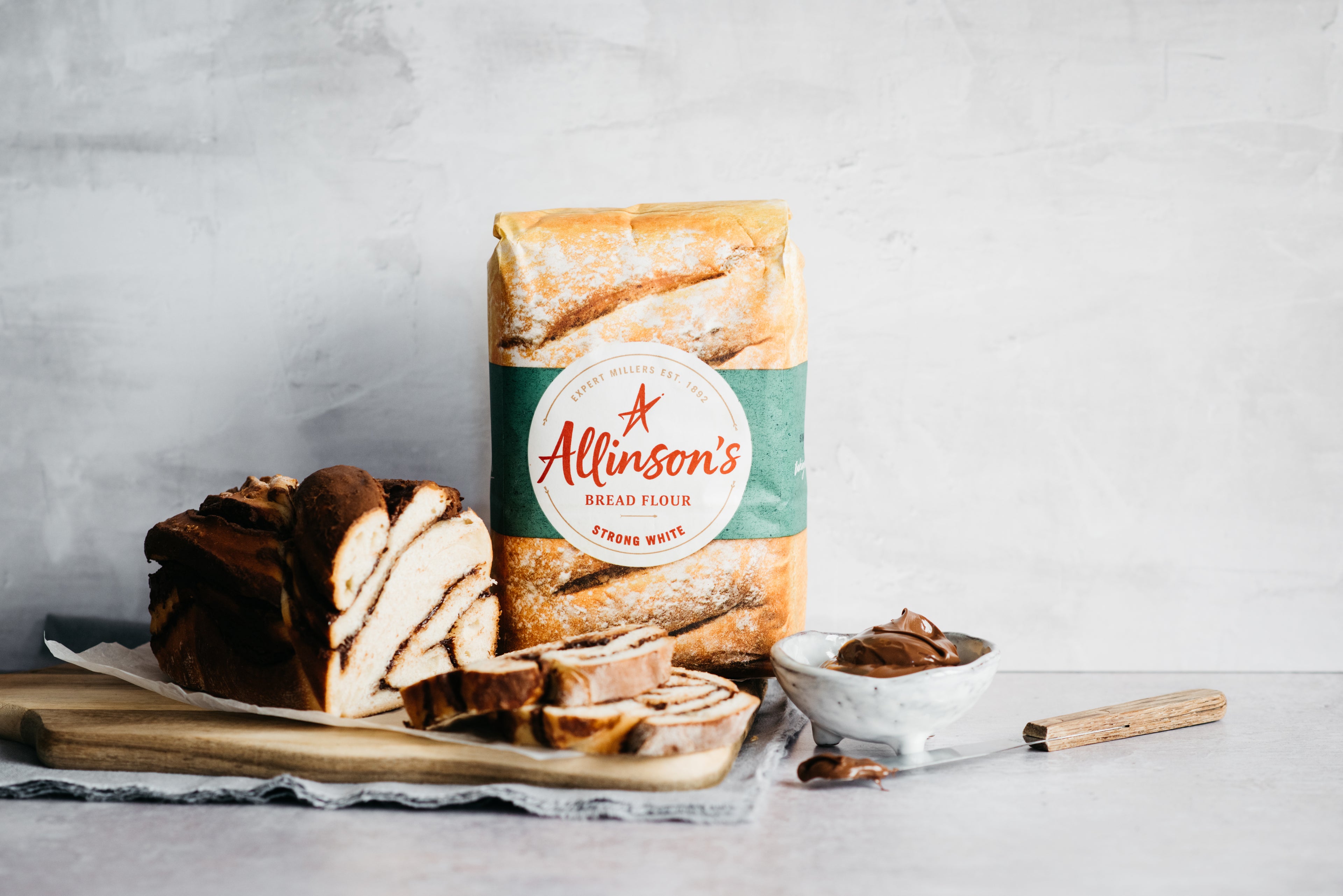 Sliced Chocolate Babka with Allinson's flour and a bowl of chocolate spread