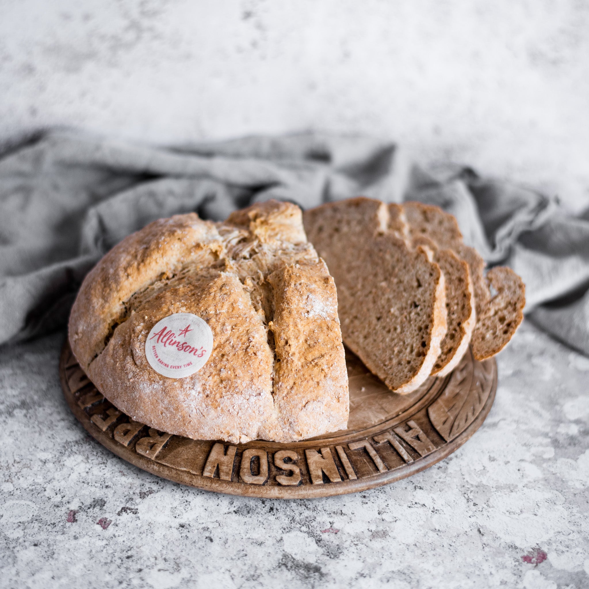 Slices of fresh Soda Bread on a wooden breadboard 